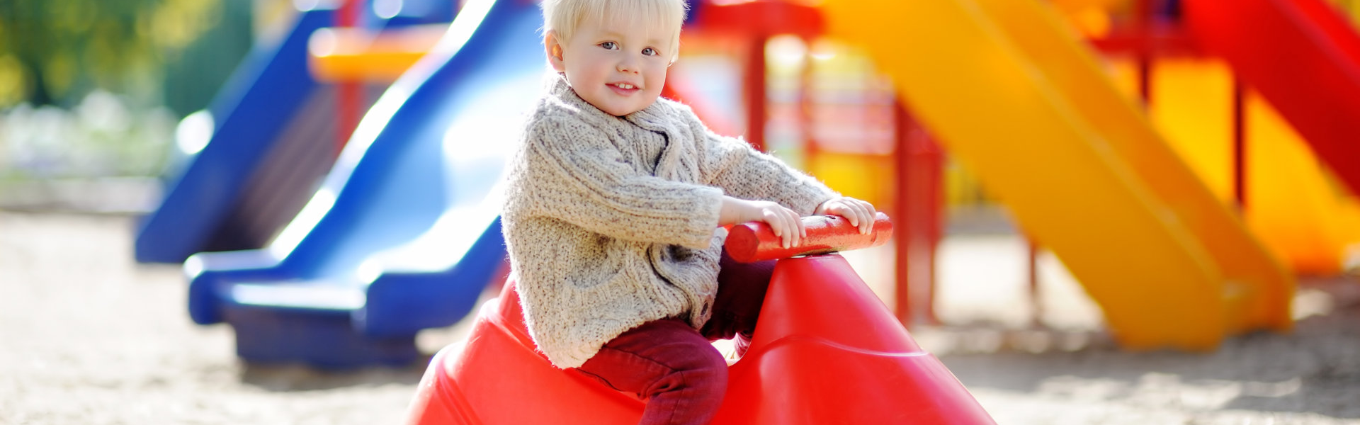 male kid riding a toy