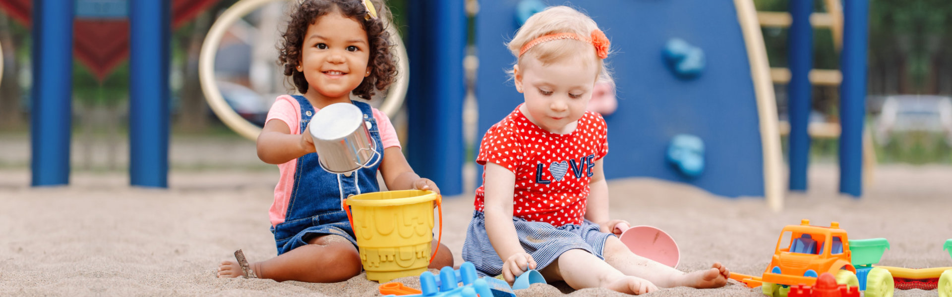 two kids playing in the sand