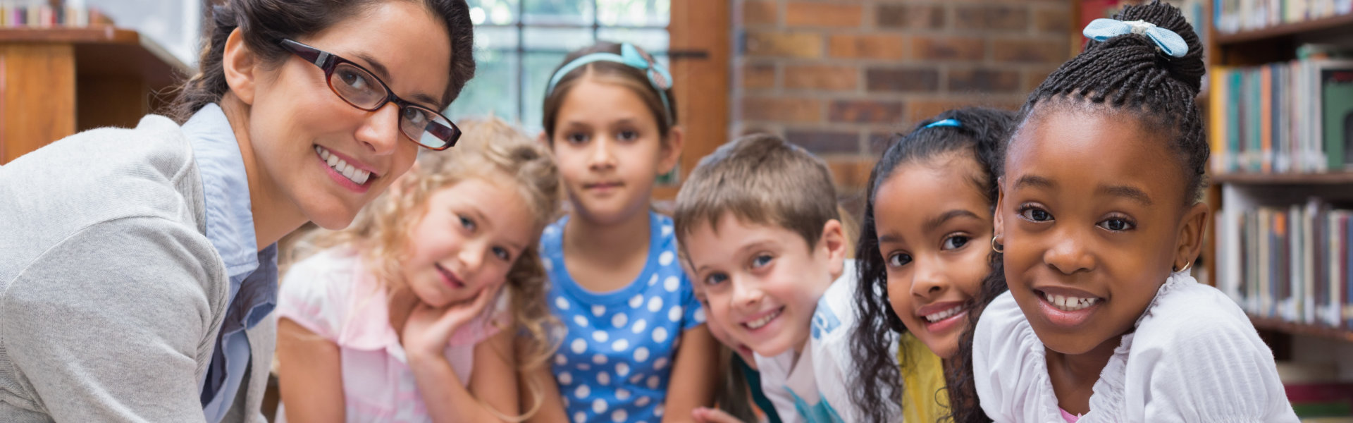 kids and a woman smiling