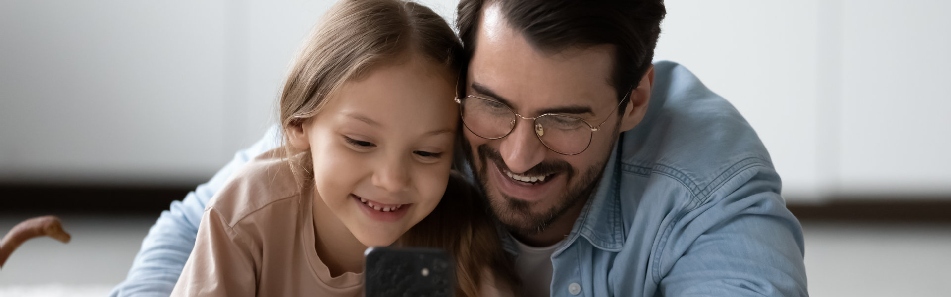 father and child smiling